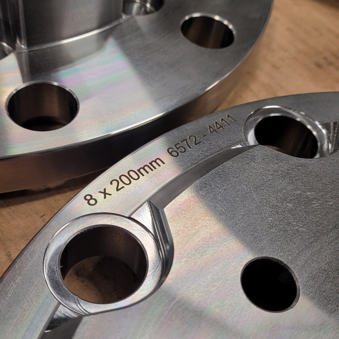 Billet adapter with the bolt pattern engraved into the face